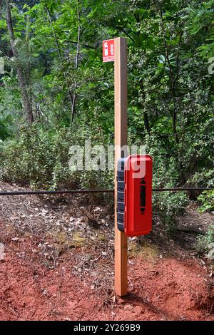 Fire Extinguisher in Mediterranean Forest on 'Sentier des ocres', Ochre Trail of Footpath Roussillon Luberon Regional Park Vaucluse Provence France Stock Photo