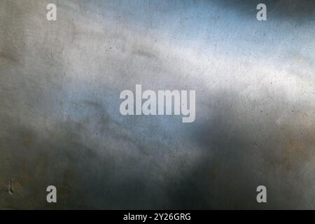 Close-up of scratched and weathered metal surface. Backgrounds and textures. Stock Photo