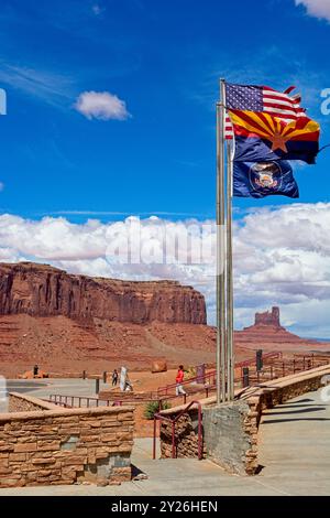 American flag waving in breeze beside Utah and Arizona state flags on terrace outside Monument Valley visitor center -- Arizona, April 2024 Stock Photo