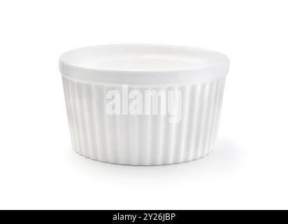 New empty ceramic white ramekin isolated on white. Stock Photo