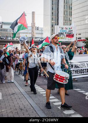 Stockholm, Sweden - September 7 2024: A public protest supporting Palestine and opposing Zionism took place on Sveavägen. The crowd, accompanied by dr Stock Photo