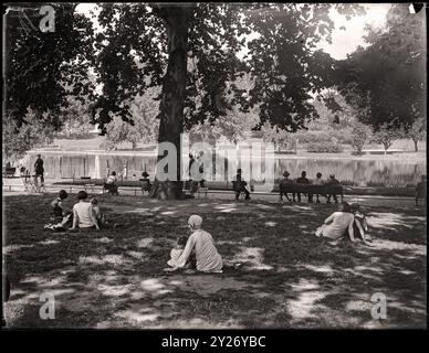 Visitors seek shade St. James Park in London during a summer heat wave. August 27th, 1931. Image from 4x5 inch glass negative. Stock Photo