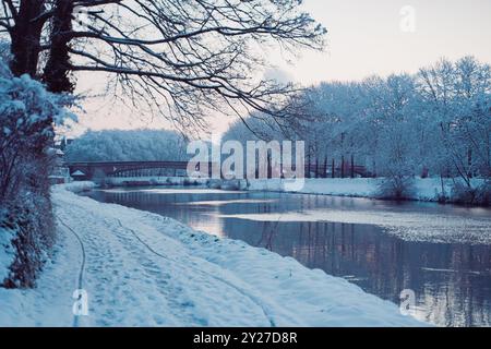 River Near a Walking Bath  Flowing Under a Stone Bridge on a Cold Winter Day Stock Photo
