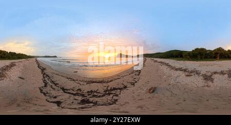 360 degree panoramic view of 360 VR panorama of pacific ocean beach la flor in Nicaragua on sunset time pink colors