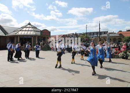 Whitby North Yorkshire August 21st 2024 Morris Dances dancing at Whitby folk festival near the harbour on a summers day Stock Photo