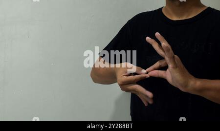 young man using sign language interpreter to communicate Stock Photo