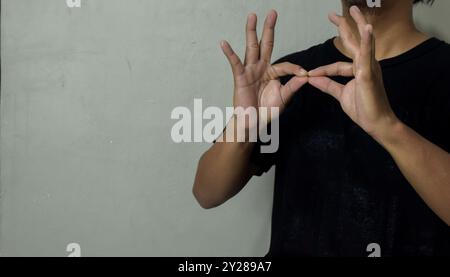 young man using sign language interpreter to communicate Stock Photo