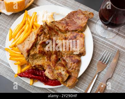 Pork steaks with fried potatoes Stock Photo