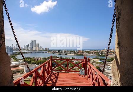 View of new and old city Cartagena with sea on a sunny day from a red wooden bridge of Castle San Felipe de Barajas, Colombia, South America Stock Photo