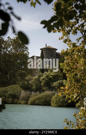 An old castle with a tower, surrounded by lush nature and calm waters, Lake Toblino, South Tyrol, Italy, Europe Stock Photo