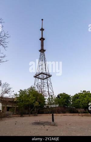 isolated transmission tower with bright sky background at evening Stock Photo