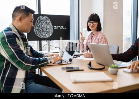 IT experts collaborating on artificial intelligence development Stock Photo