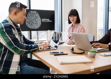 IT experts working on artificial intelligence development in modern office Stock Photo