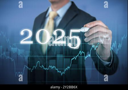 Financial success in 2025. Businessman economic forecast for 2025. Forecast of economic indicators of financial activity of companies for 2025 Stock Photo