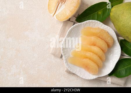 Fresh peeled pomelo with leaf on white table background for Mid-Autumn Festival fruit. Stock Photo