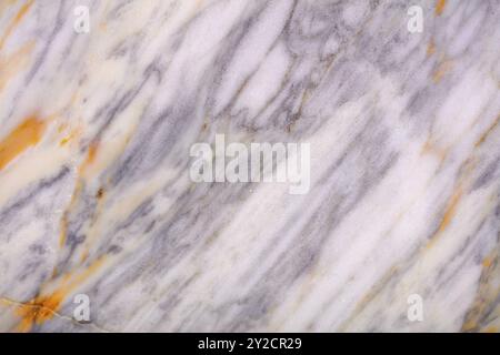 High-quality marble slab texture featuring gold and gray veins for architecture. Stock Photo