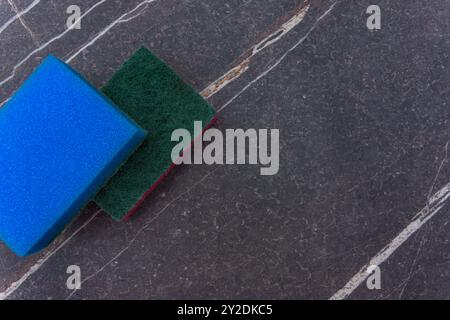 Two cleaning sponges on a marble background Stock Photo