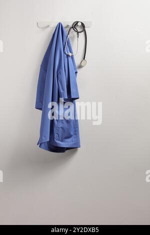 Medical blue uniform and a stethoscope on a hanger isolated on white background Stock Photo