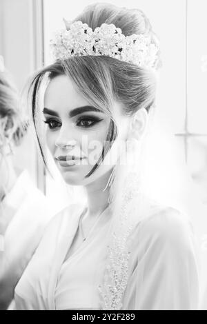 Elegant Black and White Portrait of a Bride in Exquisite Bridal Attire with Ornate Hairpiece. Stock Photo