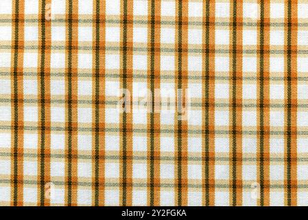 Checkered yellow fabric. Textile. Checkered fabric background with yellow and white cells Stock Photo