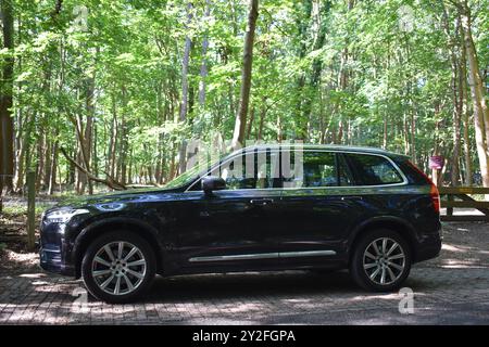 Hilversum, the Netherlands - September 8, 2024: a black Volvo XC90 suv parked in a forest Stock Photo