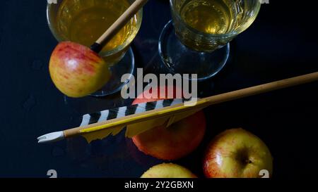 Two glasses of apple juice, apples, arrows. Stock Photo