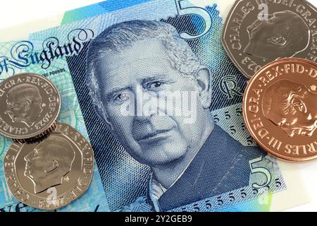 United Kingdom, June 5 2024 - Issue of new pound notes with the image of King Charles III and circulating series of new coins Stock Photo