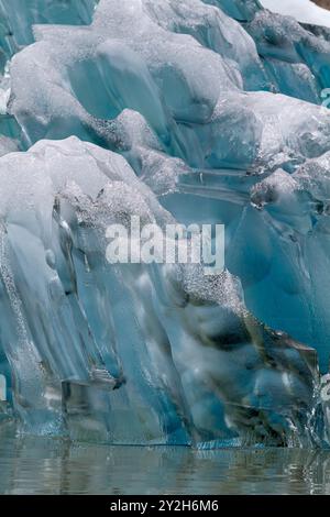 Glacial iceberg detail from ice calved off the South Sawyer Glacier in Tracy Arm, Southeast Alaska, USA, Pacific Ocean. Stock Photo