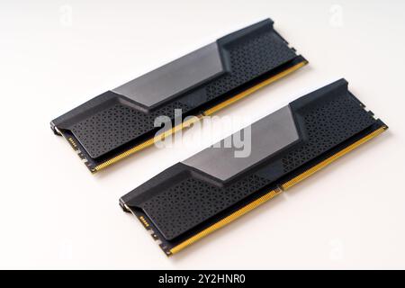 A Pair of Sleek Black and Gray Computer Memory RAM Sticks Isolated on a Clean White Background Stock Photo