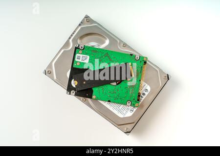 Comparison of Hard Drive and Solid State Drive on White Background for Technology Insights Stock Photo