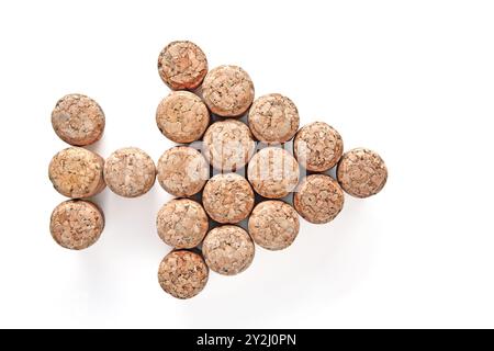 champagne wine corks arranged in the shape of an arrow pointing to the right isolated on a white background Stock Photo