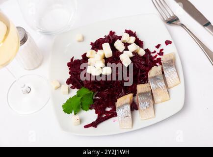 Beetroot served with cheese and pickled mackerel Stock Photo