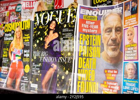 Newspaper rack with several international publications - The National Enquirer, Vogue and Cosmopolitan. Covers featuring Jeffrey Epstein, Kylie Jenner Stock Photo