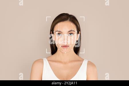 Woman with facial recognition technology analysis against a neutral background Stock Photo