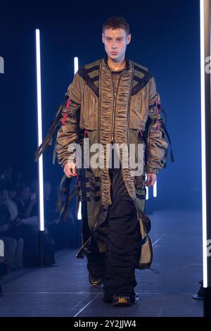 A model walks the runway during the MARCUS COVINGTON show during the Rakuten Fashion Week Tokyo 2025 Spring and Summer at Shibuya Hikarie on September Stock Photo