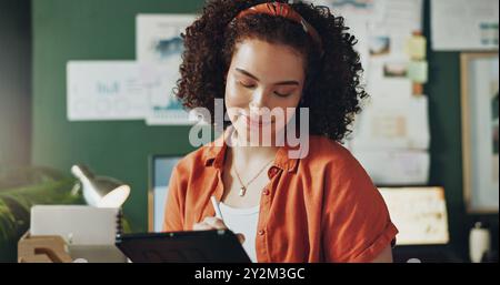 Business woman, creative and tablet in office for research, writing notes and drawing digital sketch. Graphic designer, happy and technology for Stock Photo