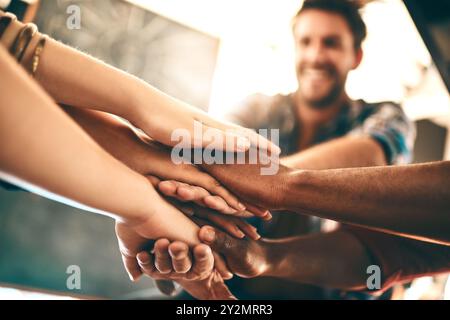Creative, team and hands stack in office for business, creativity and collaboration. Employees, synergy and gesture in workplace for community Stock Photo