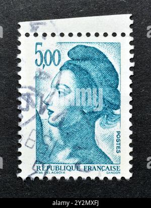 Cancelled postage stamp printed by France shows Marianne by Gandon, circa 1984. Stock Photo