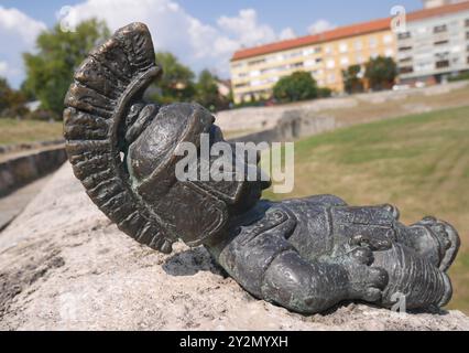 In Vino Veritas, a bronze mini statue by Hungarjan Ukrainian sculptor Mihaly Kolodko, Aquincum military amphitheatre, Obuda, Budapest, Hungary Stock Photo