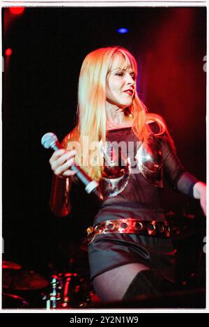 TOYAH, CONCERT, 2002: Punk icon Toyah Wilcox playing live in a steel breastplate, mini-skirt and thigh high boots at Cardiff International Arena in Cardiff, Wales, UK on on 18 April 2002. Photo: Rob Watkins. INFO: Toyah Willcox, known mononymously as Toyah, is a British singer, actress, and presenter. Rising to prominence in the late '70s and '80s, her vibrant stage presence and diverse career span pop music, film, and theatre, establishing her as a multifaceted and iconic entertainer. She appeared on Strictly Come Dancing in 2024. Stock Photo