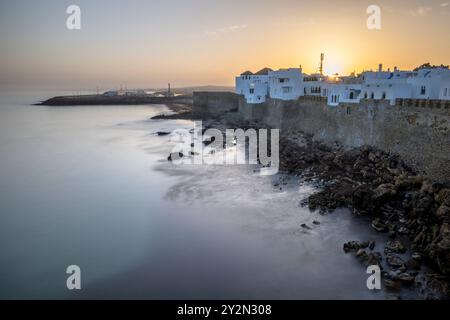 Asilah or Assilah at dawn. Sunrise over the Medina of a beautiful Moroccan marine city. Moroccan Atlantic coast, Tangier or Tanger province. Stock Photo