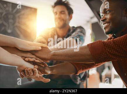 Creative, people and hand stack in office for business, creativity and collaboration. Employees, synergy and gesture in workplace for community, team Stock Photo
