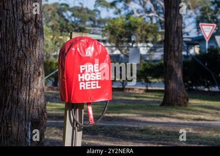 Fire hose reel, outdoors, campersite, NSW, Australia Stock Photo
