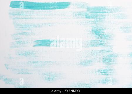 Blue green (teal) color paint brush strokes on white paper. Abstract pattern background. Stock Photo