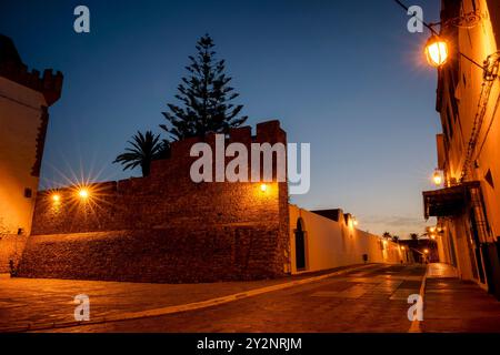 Assilah Medina at dawn. Moroccan colonial architecture inside the old town of a beautiful marine city. Stock Photo