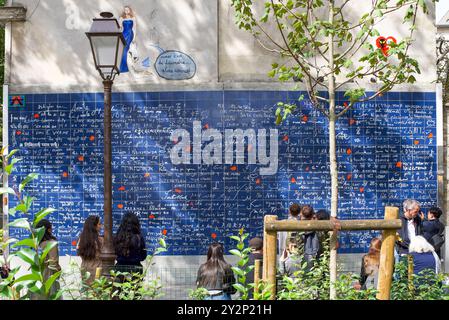 The wall of 'I love you' in many foreign languages, in the garden of the Jehan Rictus square. One of the film locations of the series Emily in Paris Stock Photo