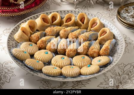 Plate with a variety of traditional festive Moroccan cookies isolated on the table close up Stock Photo