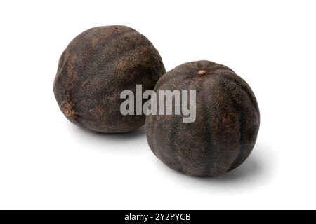 Pair of dried black limes, loomi, isolated on white background close up Stock Photo