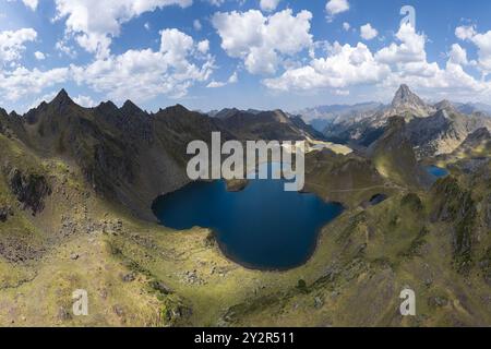 From above, this breathtaking aerial view captures the stunning Lacs d'Ayous nestled in the French Pyrenees. The pristine blue lakes are surrounded by Stock Photo