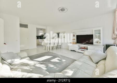 Bright and spacious living room with modern furniture and open floor plan. Stock Photo